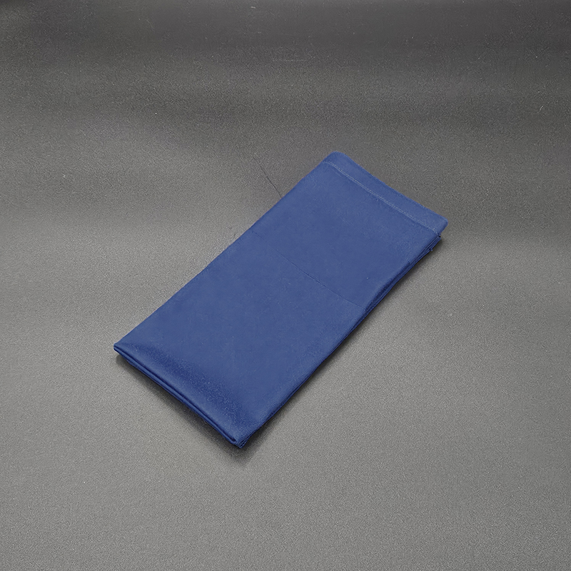 Eight shirts arranged on table in black, olive, grey, blue, white, red, mustard, and green.
