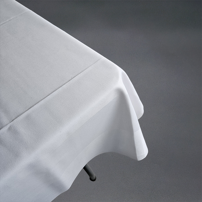 Eight shirts arranged on table in black, olive, grey, blue, white, red, mustard, and green.