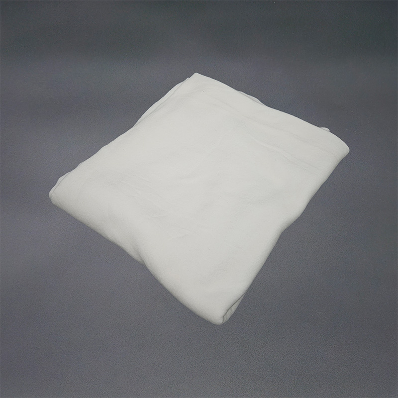 Eight shirts arranged on table in black, olive, grey, blue, white, red, mustard, and green.